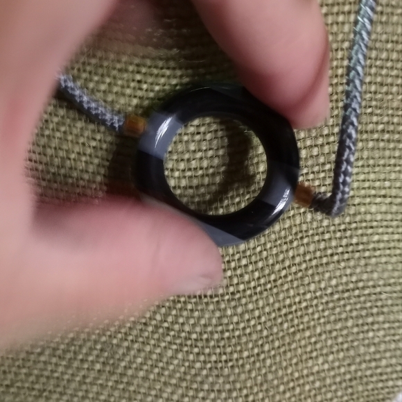 Goldtone gray black round donut pendant on gray cord necklace - Picture 2 of 3